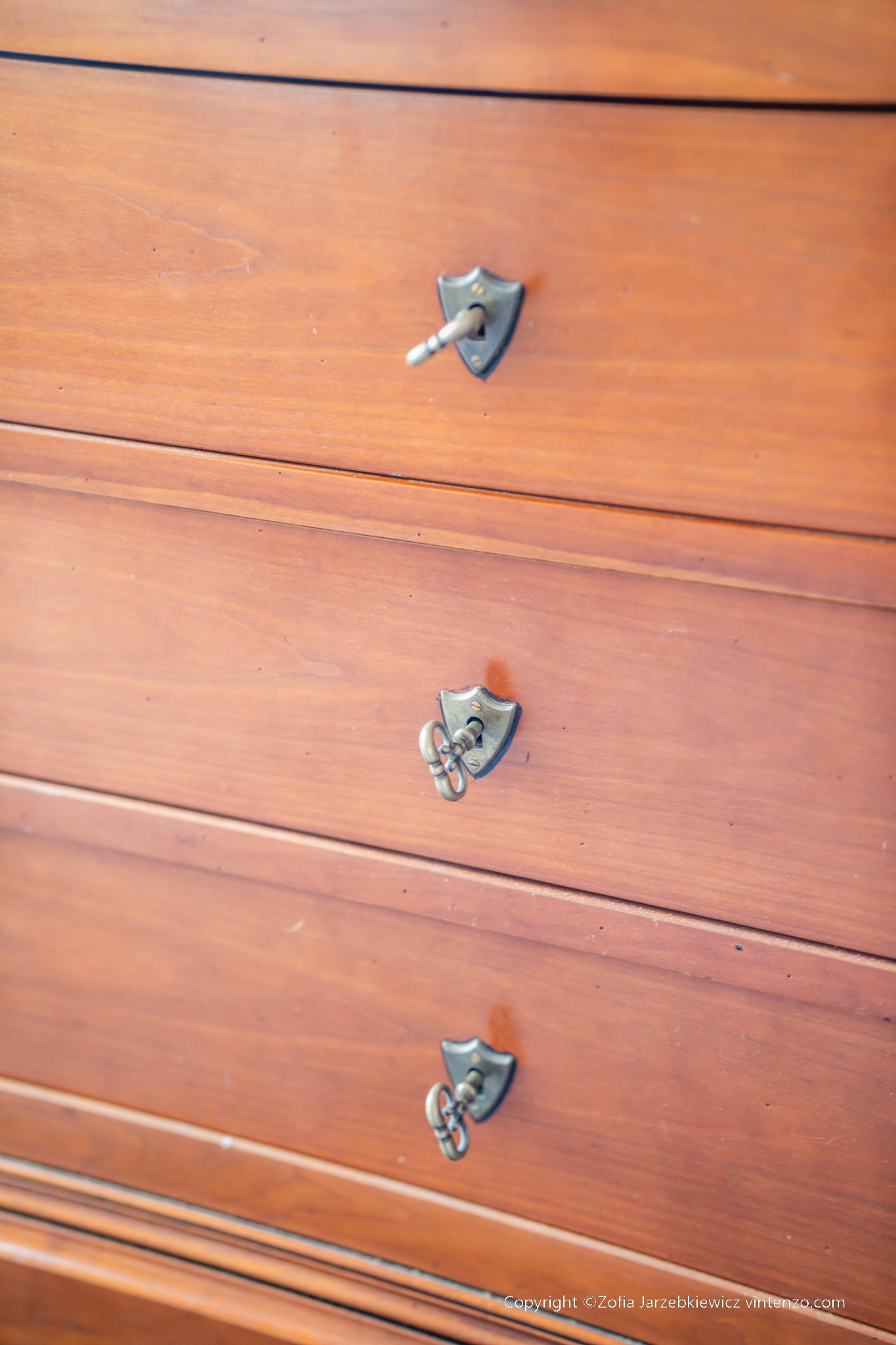 A French Cherrywood Four Drawer Chest of Drawers