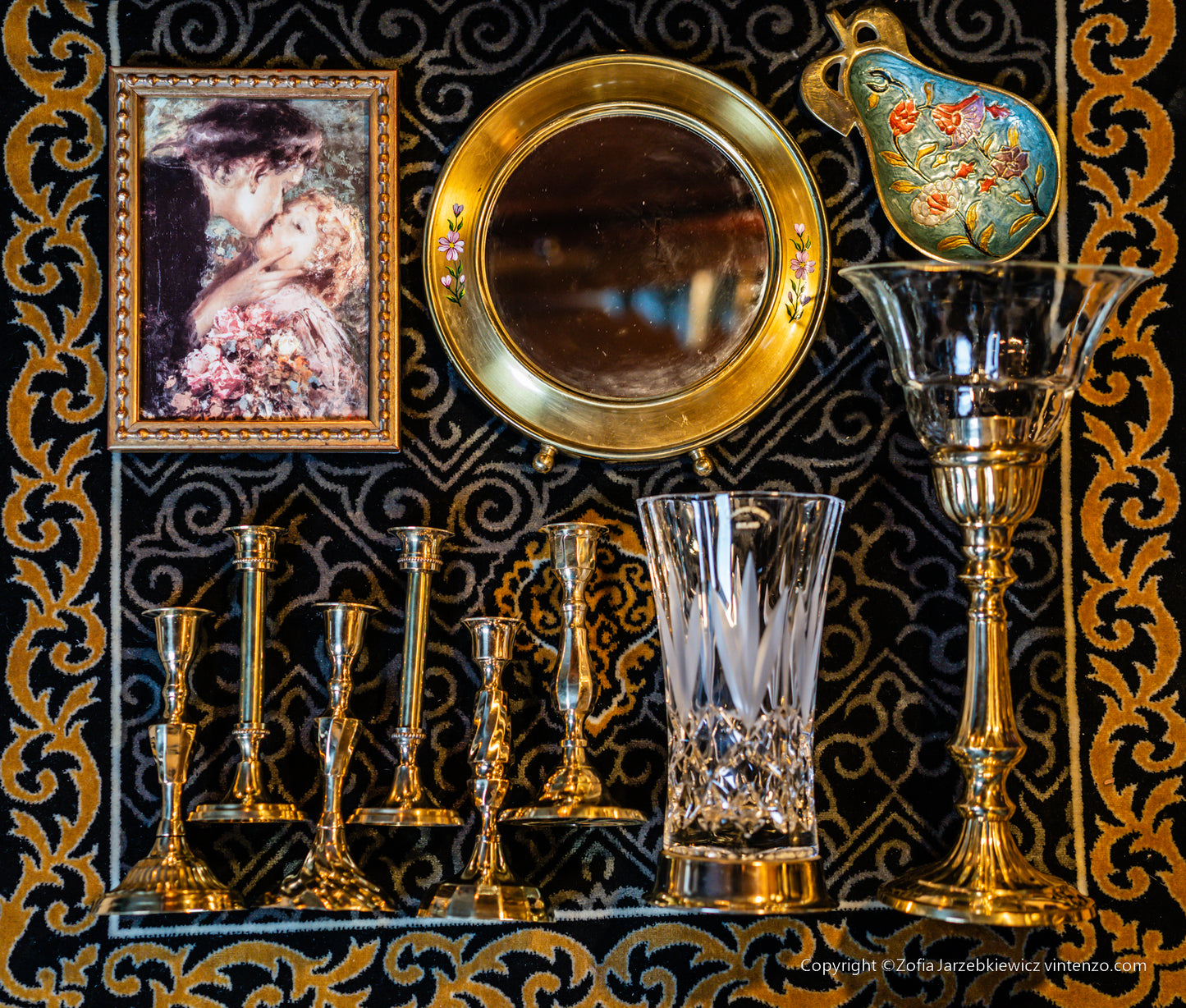 Small Vintage Mirror with a Gold Frame and Small Flowers on the Sides